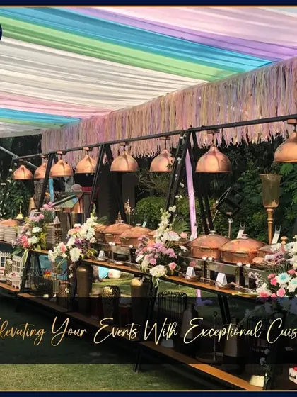 A colorful and festive outdoor buffet setup under a rainbow-hued canopy. This image shows our ability to match our setups to any wedding theme, from elegant and classic to bright and celebratory.