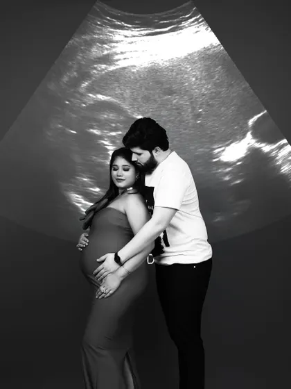 A truly unique concept where we project the baby's ultrasound scan onto the background, creating a powerful first family portrait.
