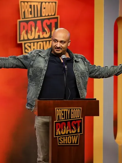 A performer owning the stage at the Pretty Good Roast Show.