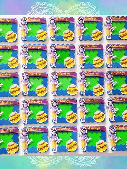 A full set of the standing Little Krishna photo frames, ready for a party. The vibrant green and blue backgrounds make the design pop.