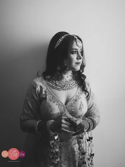 A thoughtful black and white portrait of the bride, Simrita, during her getting-ready moments.