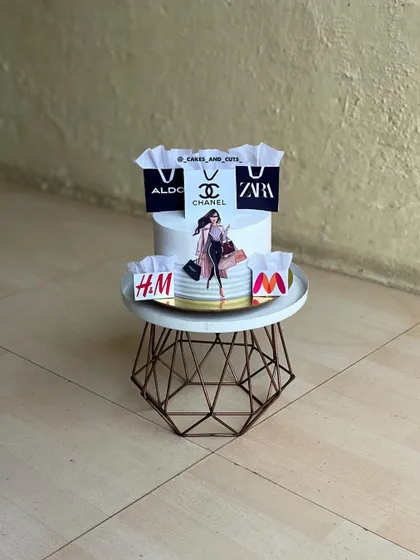 For the woman who loves to shop. This cake is decorated with edible images of shopping bags from popular brands like Zara, Chanel, and H&M.