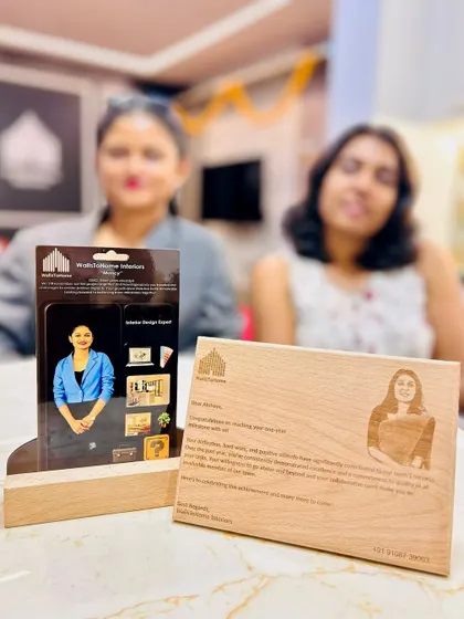 Celebrating the work anniversaries of two incredible team members, Mancy and Akshaya, with custom-engraved plaques.