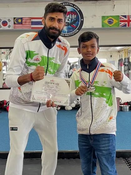 One of my young champions with his silver medal from the International Thai Martial Arts games. We build fighters from a young age.
