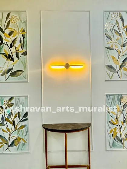 A multi-layered mural featuring four framed panels of botanical art with gold foil accents. This is a classic and elegant way to decorate a foyer or hallway.