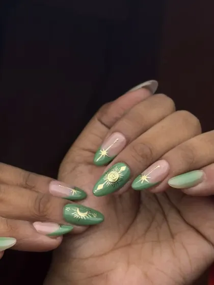 A celestial-themed design featuring hand-painted sun, moon, and star motifs in gold on a beautiful green base. This almond-shaped set shows my skill with fine-line details and trendy designs.