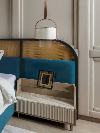 A closer look at the details in the daughter's bedroom. The custom bedside table with its fluted design, the hanging pendant light, and the elegant study nook with a wooden slatted wall all contribute to a space that is both youthful and sophisticated.