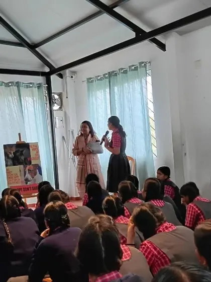 A student bravely steps up to ask a question during our workshop. We encourage curiosity and open dialogue, creating a safe space for children to share their thoughts and fears about animals.