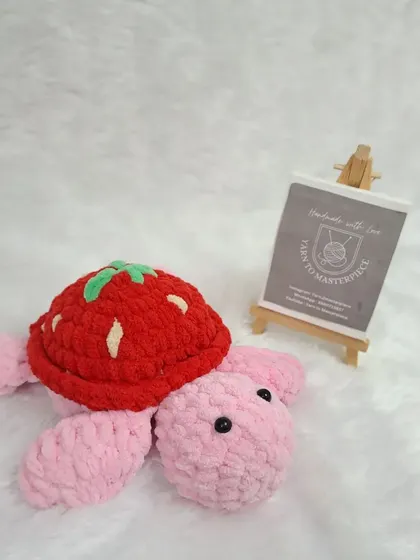 A single plush strawberry turtle.