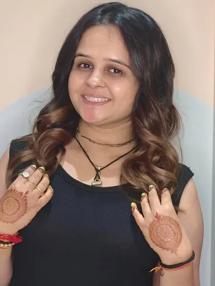 Shining bright with these stunning golden tong curls. This client is ready for a celebration with her glamorous new hairstyle.