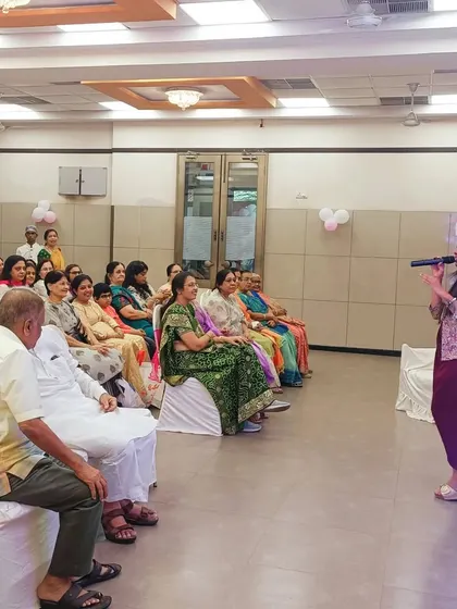 Addressing the guests at a welcome baby celebration. I love sharing stories and creating a narrative that connects everyone in the room to the happy occasion.