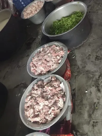Preparing for a 150kg Mutton Biryani order in Tirunelveli. You can see the fresh mutton and chopped herbs ready to go into the pots.