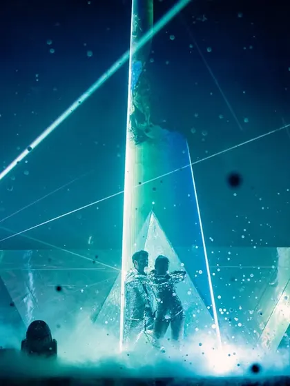 For couples who want something modern and edgy, I create high-tech experiences like this laser-programmed entry. I spent weeks syncing the laser patterns and light beams with the music to build suspense before the final, dramatic reveal.