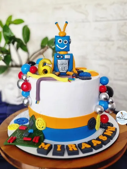 This robot and circuits themed cake was for a 6th birthday. I had so much fun creating the little fondant robot, motherboard, gears, and wires for a future engineer.