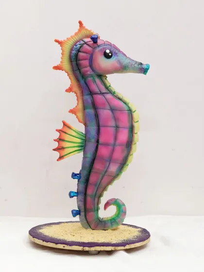 A full view of the impressive sculpted seahorse cake. The class covers creating the internal structure, carving the cake, and adding all the final decorative details.