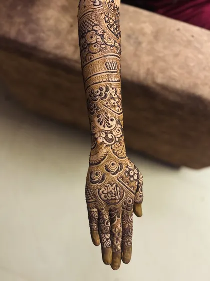 A classic full-hand Indian floral design. The patterns are tightly packed, which is characteristic of traditional bridal mehendi, ensuring a very dark and beautiful stain.
