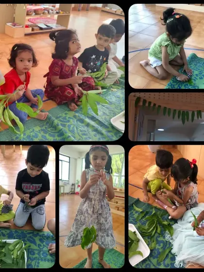 Children sit together and carefully thread mango leaves to make traditional torans for Ugadi. This activity enhances fine motor skills and teaches cultural traditions.