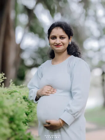 A simple and elegant solo portrait of the mother-to-be. Her calm demeanor and the soft natural light create a timeless and beautiful image.