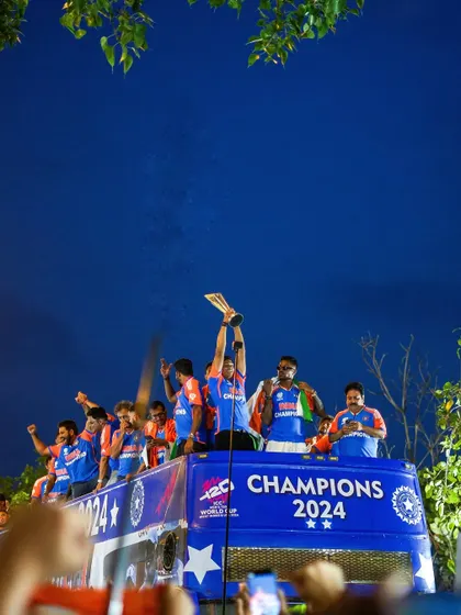 A photo series from the victory parade, capturing the Indian cricket team celebrating with the trophy on an open-top bus at Marine Drive. The images are filled with the joy and pride of the players and fans.