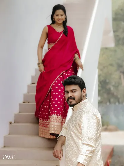A playful composition on a staircase, with the bride-to-be descending towards her partner.