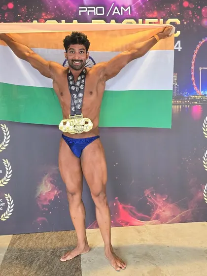 Holding the Indian flag high after winning at the Asia Pacific natural bodybuilding championship in Singapore. This was my return to the stage after a decade.
