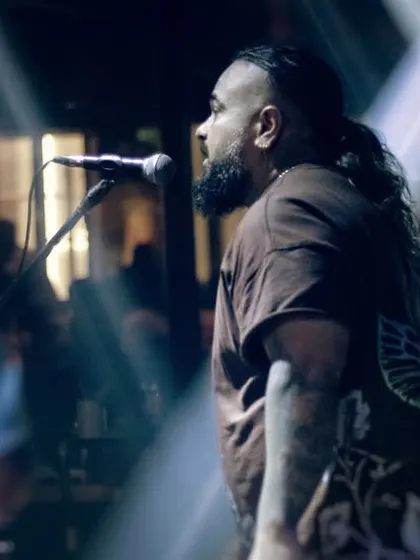 Another angle of our vocalist, commanding the stage. We use the entire space to engage with the audience and create a dynamic visual and auditory experience.