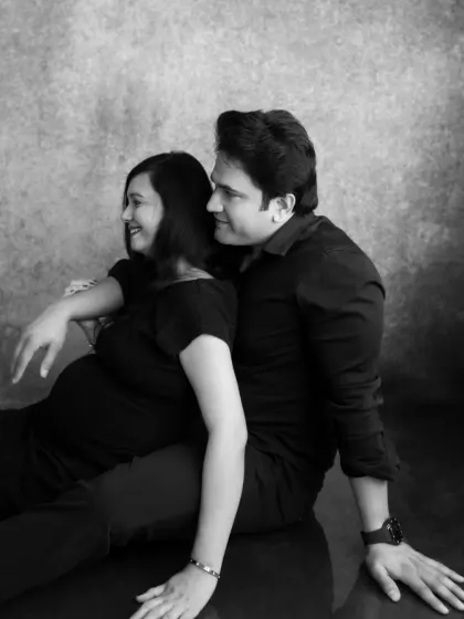 A candid moment captured in black and white. The shared glance between the couple tells a story of their journey together.