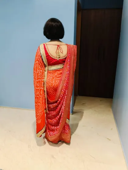 Draping the CEO of Reliance group of hospitals for the Ambani Mameru function. This traditional saree with dupatta drape was created to match the pink and orange theme.
