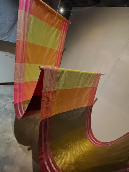 More sarees on display at the Hampi exhibition, showcasing the vibrant colors and diverse weaving techniques found across Karnataka.