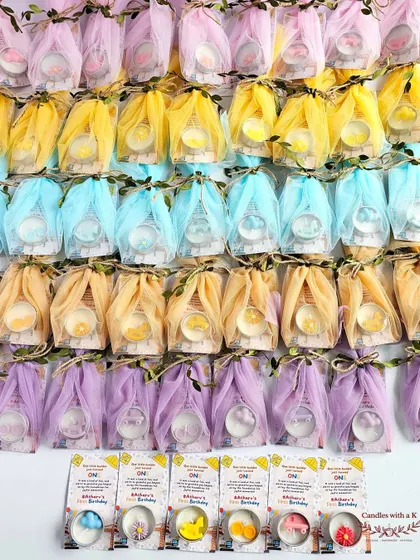 The construction-themed tealights all wrapped up in colorful net, creating a vibrant display.