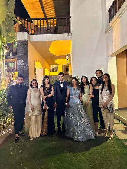 A group picture with the couple and their friends at the reception. These are the memories that last a lifetime.