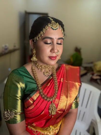 Another angle of Dr. Indhu's makeup, showing the smooth, airbrushed finish of the foundation and the perfectly blended contour that enhances her features.