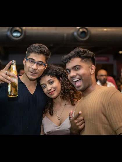 More happy faces from the crowd, capturing the fun and friendly atmosphere.