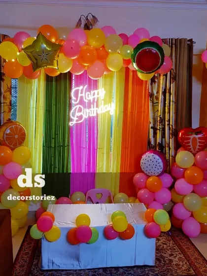 Another view of the fruit-themed decor, showing how the bright colors and fun elements can liven up any room for a birthday party.