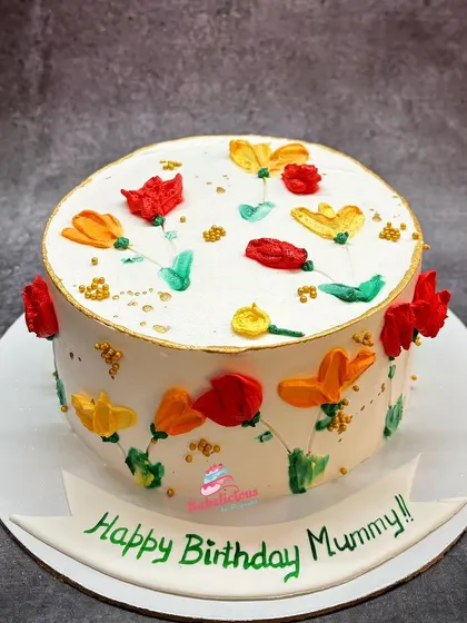 A bright and cheerful floral cake for a mother's birthday. I used a palette knife painting technique with buttercream to create these colourful, abstract flowers.