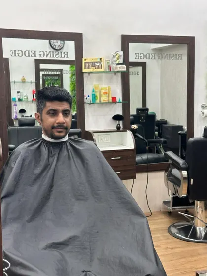 The "after" shot. A clean, classic men's cut that looks sharp and is easy to manage.