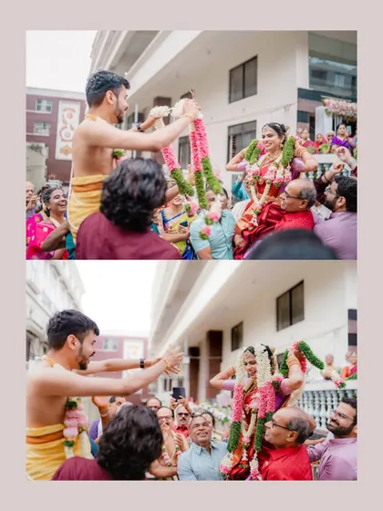 The lively garland exchange ceremony, with the bride and groom lifted high above the crowd, surrounded by laughing family members.