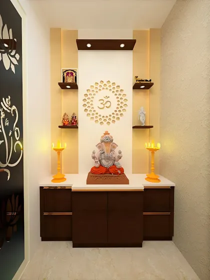 A compact pooja unit with a backlit Om mandala. The dark wood and white marble top create a clean and sophisticated design.