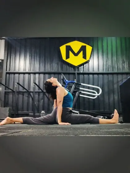 Adding a gentle backbend to the front split. This variation opens the heart and shoulders while deepening the stretch in the hip flexors.