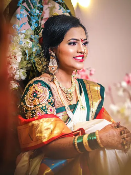 A radiant bride captured during her wedding ceremony. The soft lighting and her gentle smile create a warm and inviting portrait.