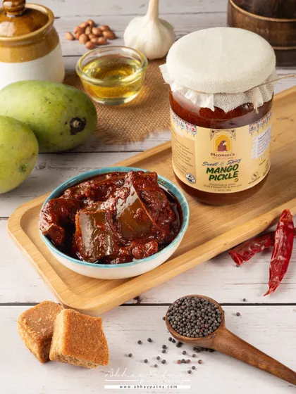This photo is about more than just the pickle; it's about tradition and authentic flavour. I styled the shot with all the key ingredients like raw mango, jaggery, and spices to tell the story of how the product is made. This approach helps build trust and communicates quality.
