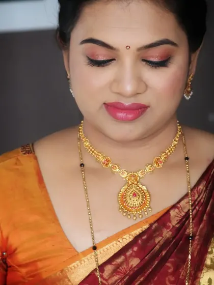 Bhanu's housewarming party look. The makeup is soft and natural, with a peachy-pink lip that adds a touch of warmth and freshness.