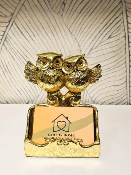 This golden owl card holder is a functional and stylish accessory for your office desk. It keeps your business cards handy while adding a touch of glamour.