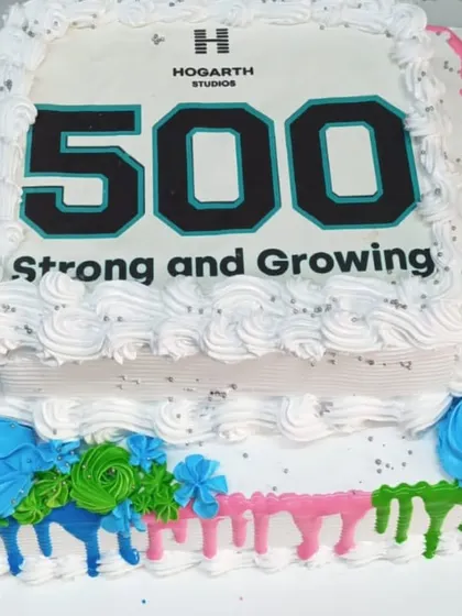 We celebrate your company's achievements with you. This custom two-tier cake was created for Hogarth Studios to mark their milestone of reaching 500 employees, demonstrating our ability to create branded desserts for your special corporate occasions.
