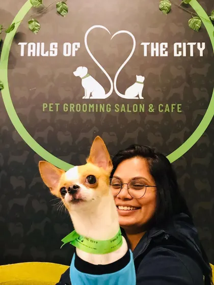 Max the Chihuahua is all smiles with his mom. We love our tiny clients and handle them with the extra gentle care they need.