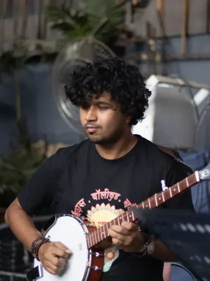 Someone asked how many instruments we have at Let's Jam. Well, here's our multi-talented musician rocking a banjo.