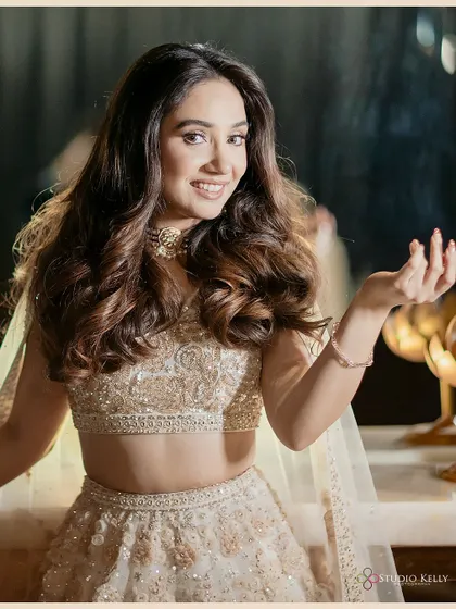 A candid and happy portrait of the bride, her natural smile lighting up the photo.