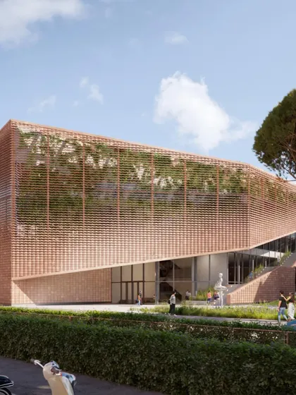 The terracotta screen facade gives the building a distinct identity while responding to the local climate and architectural heritage.
