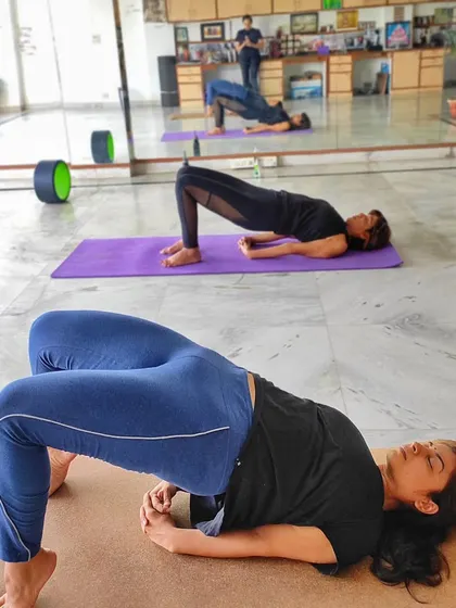 Students in Setu Bandhasana (Bridge Pose) during a class at my Delhi center. This pose is fantastic for strengthening the back and opening the chest, and we explore different variations to suit everyone.