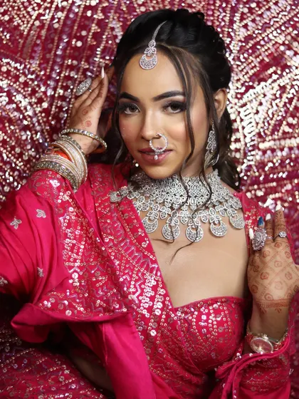 A confident and happy bride, showcasing the transformative power of professional makeup.